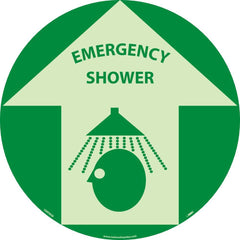 NMC - Adhesive Backed Floor Signs; Message Type: First Aid ; Graphic Type: Head under Shower in Up Arrow ; Message or Graphic: Message & Graphic ; Legend: Emergency Shower ; Color: Green; Beige ; Special Color Properties: Glow-In-The-Dark - Exact Tooling