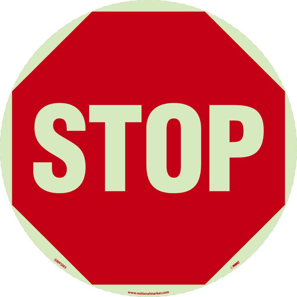 NMC - Adhesive Backed Floor Signs; Message Type: Accident Prevention ; Graphic Type: Stop Sign ; Message or Graphic: Message & Graphic ; Legend: Stop ; Color: Red on Glow ; Special Color Properties: Glow-In-The-Dark - Exact Tooling