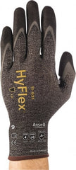 Ansell - Size 2XL (11), ANSI Cut Lvl A2, Abrasion Lvl 4, Nitrile/Polyurethane Coated HPPE Fiber Cut Resistant Gloves - 10.3937" Long, Palm & Fingers Coated, Spandex & Dyneema/Nylon Lining, Knit Wrist, Gray/Black, Paired - Exact Tooling