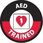 NMC - AED Trained, Hard Hat Label - Round, White & Red on Black, 0.004" Thick, Indoor or Outdoor, Adhesive Backed, For Accident Prevention - Exact Tooling