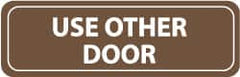 NMC - Use Other Door, 11" Wide x 3.5" High, Acrylic Sign - English, White on Brown, Wall Mount - Exact Tooling